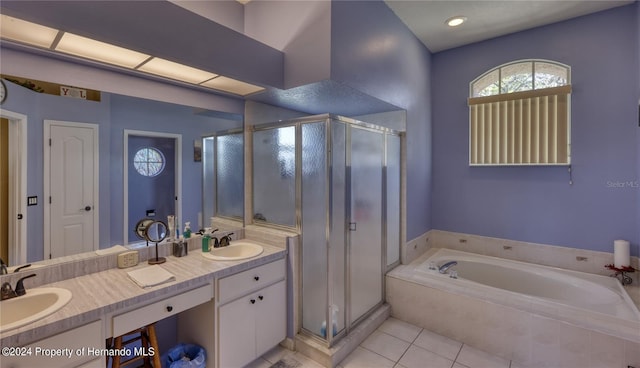 bathroom featuring vanity, shower with separate bathtub, and tile patterned floors