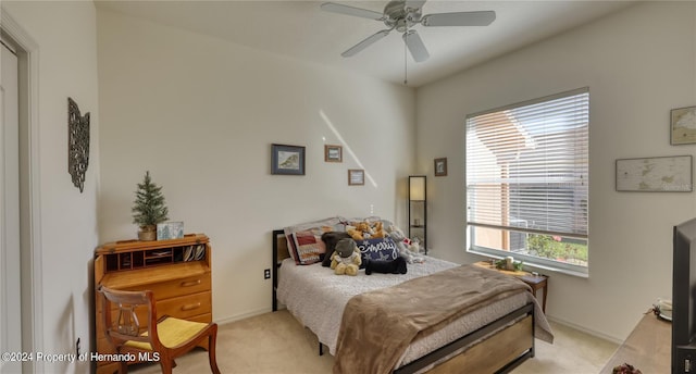 bedroom with light carpet and ceiling fan