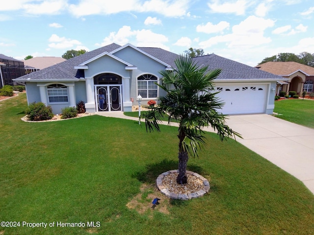 single story home with a front lawn and a garage