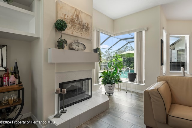 tiled living room with a tiled fireplace