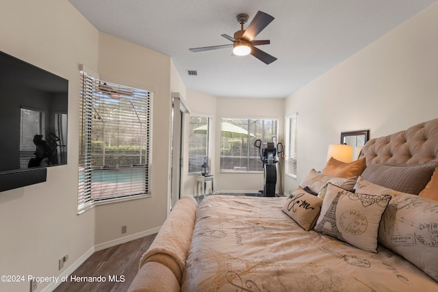 bedroom featuring hardwood / wood-style floors and ceiling fan