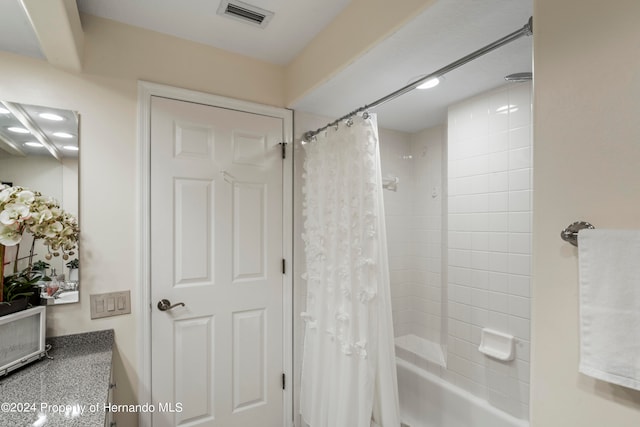 bathroom with shower / tub combo with curtain