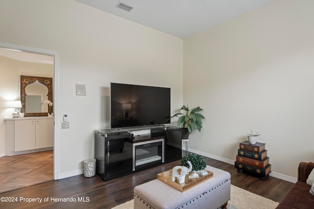 living room with dark hardwood / wood-style flooring