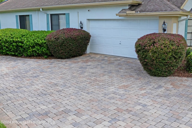 view of property exterior featuring a garage