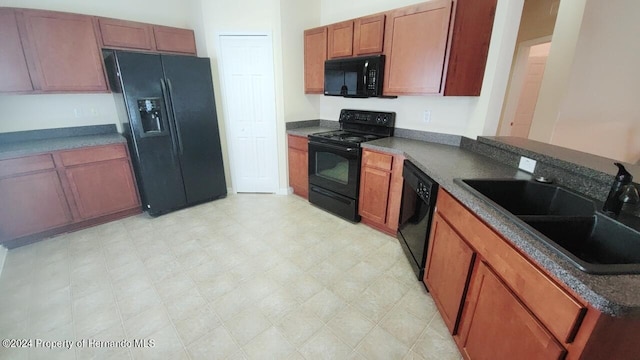 kitchen with sink and black appliances