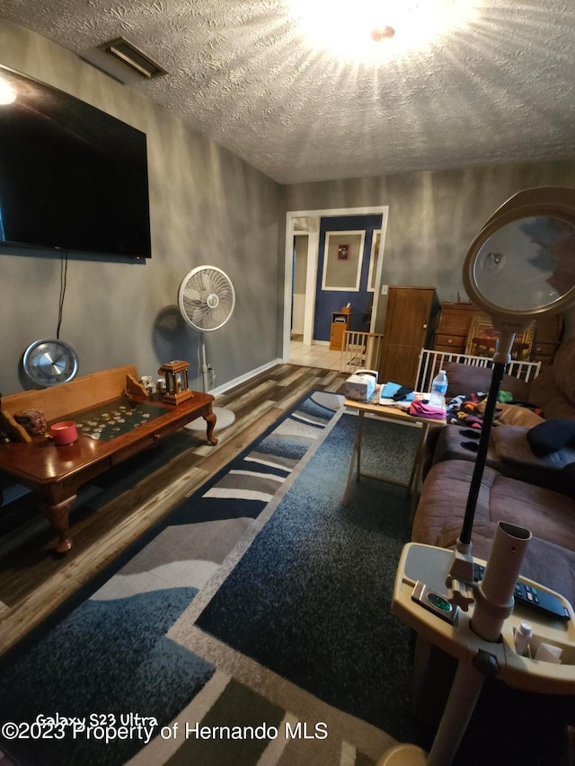 living room with a textured ceiling