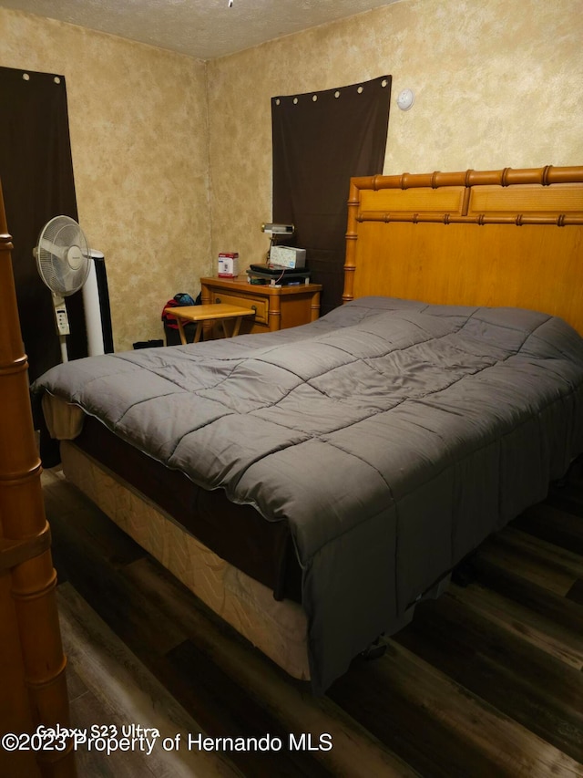 bedroom featuring dark hardwood / wood-style floors