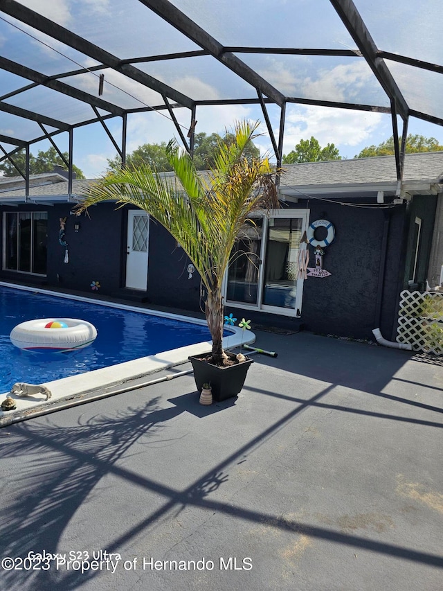 view of pool featuring a lanai and a patio area