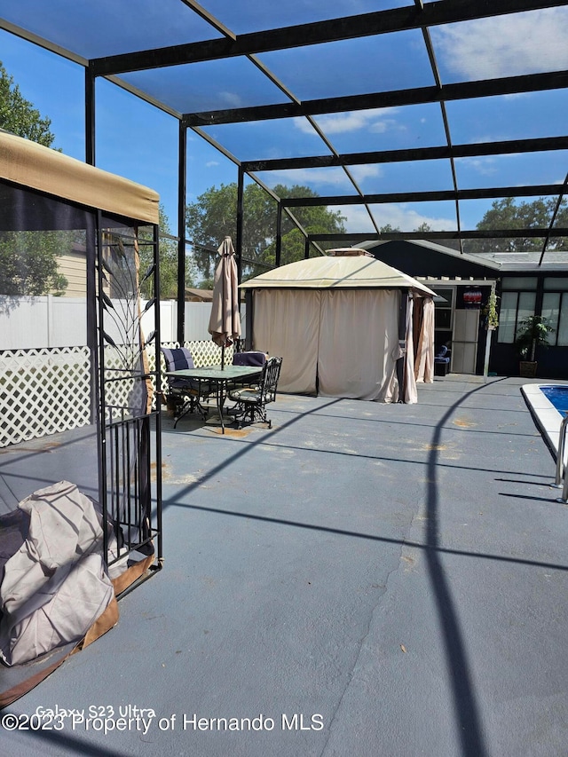 view of patio / terrace with a lanai