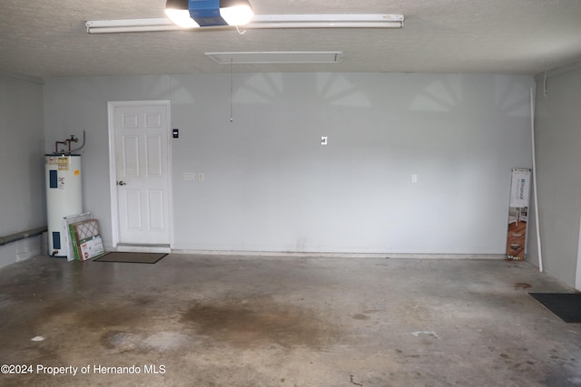 garage featuring a garage door opener and electric water heater