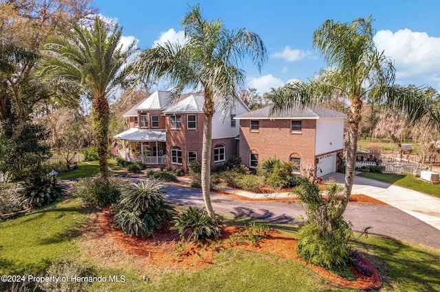 view of front of house with a garage and a front yard