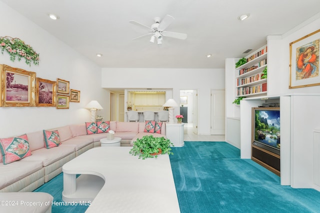 living room with dark colored carpet and ceiling fan