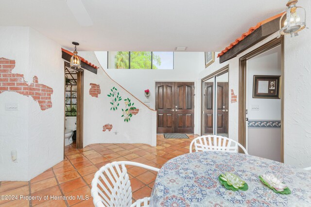 11915 W Riverhaven Dr, Homosassa, FL 34448 - dining room with tile patterned floors and stairs