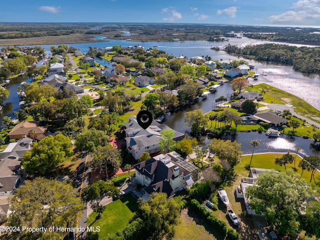 11915 W Riverhaven Dr, Homosassa, FL 34448 - aerial view of property and surrounding area with a large body of water and nearby suburban area
