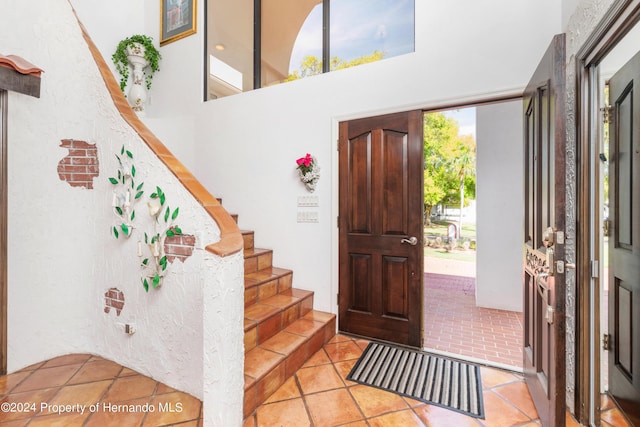 11915 W Riverhaven Dr, Homosassa, FL 34448 - tiled entrance foyer with stairs and a towering ceiling