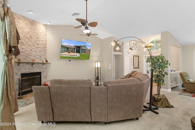 living room featuring a fireplace, light tile patterned floors, ceiling fan, and high vaulted ceiling