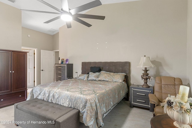 bedroom featuring lofted ceiling and ceiling fan