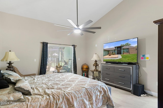 bedroom with ceiling fan and high vaulted ceiling