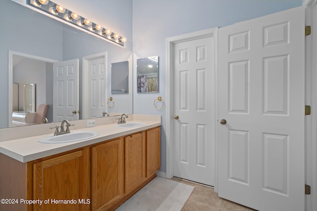 bathroom featuring vanity and tile patterned flooring