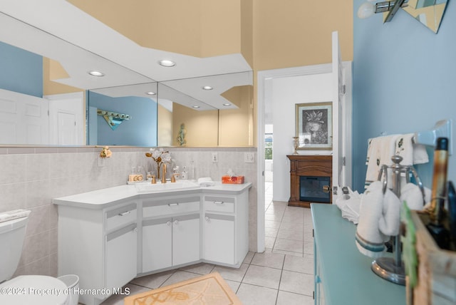 bathroom featuring toilet, vanity, and tile patterned floors