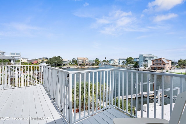 wooden deck featuring a water view