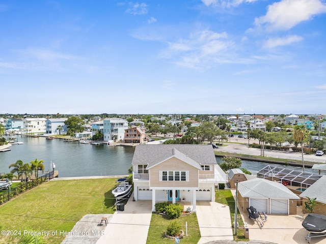 birds eye view of property with a water view