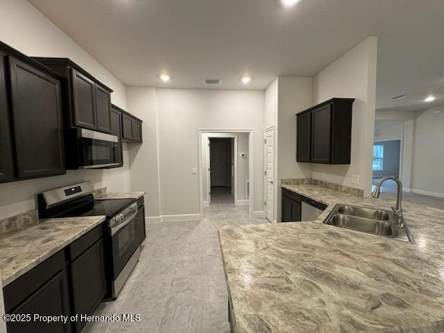 kitchen with appliances with stainless steel finishes and sink