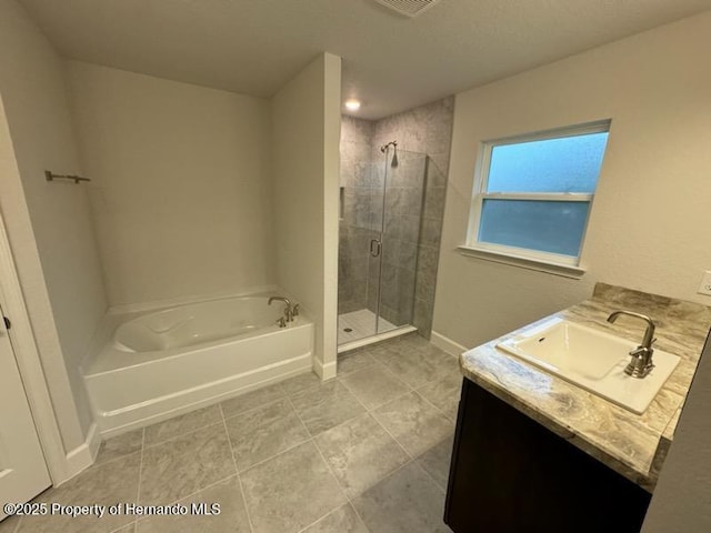 bathroom featuring vanity and plus walk in shower