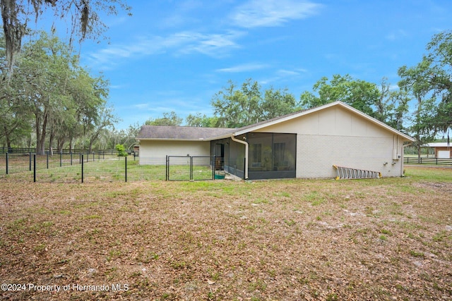 back of house featuring a yard