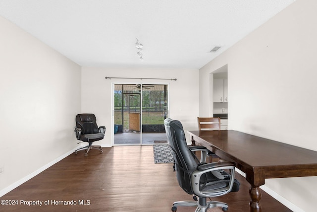 home office with wood-type flooring