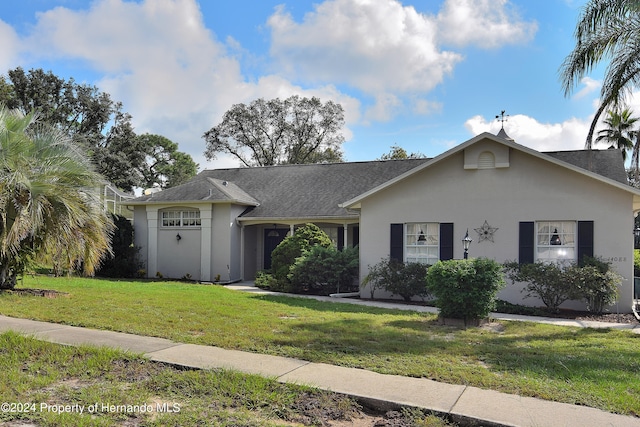 single story home with a front lawn