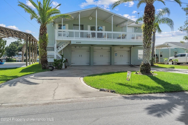 view of front of home with a front lawn and a garage