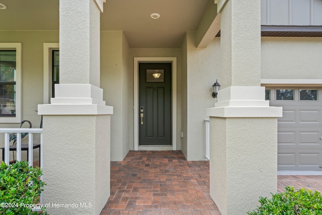 doorway to property featuring a garage