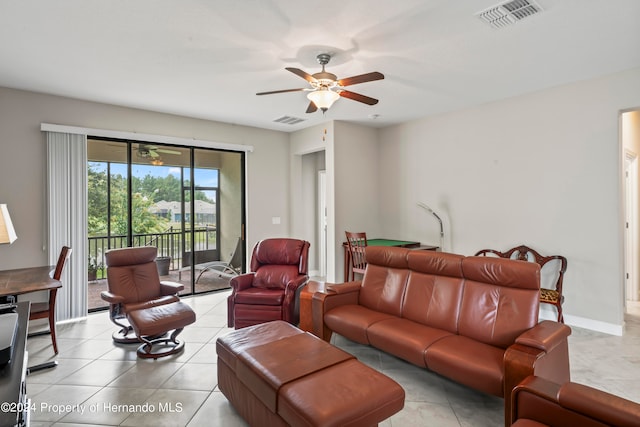 living room with light tile patterned floors and ceiling fan