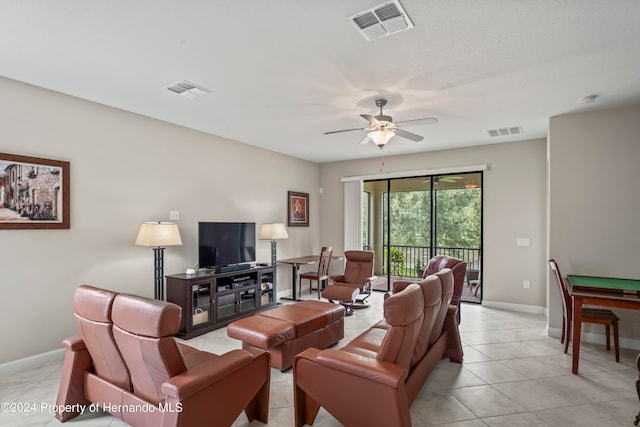 living room featuring light tile patterned floors and ceiling fan