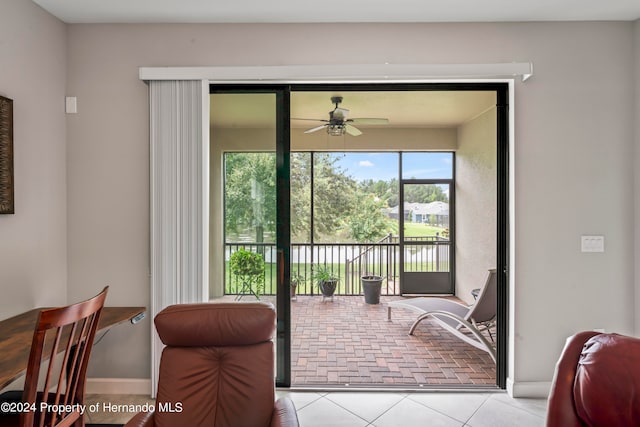 interior space featuring ceiling fan and light tile patterned floors