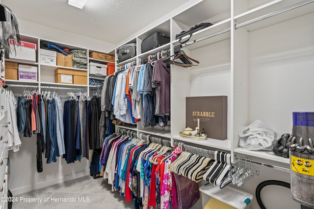 walk in closet featuring light tile patterned floors