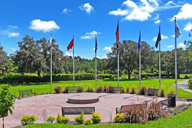 view of property's community with a lawn