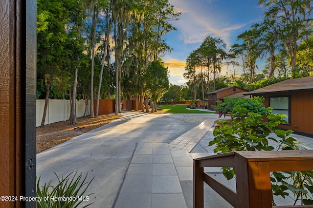 view of patio terrace at dusk