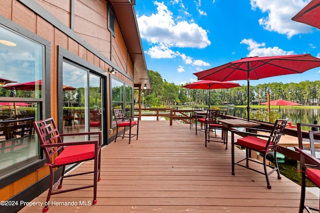 wooden deck with a water view