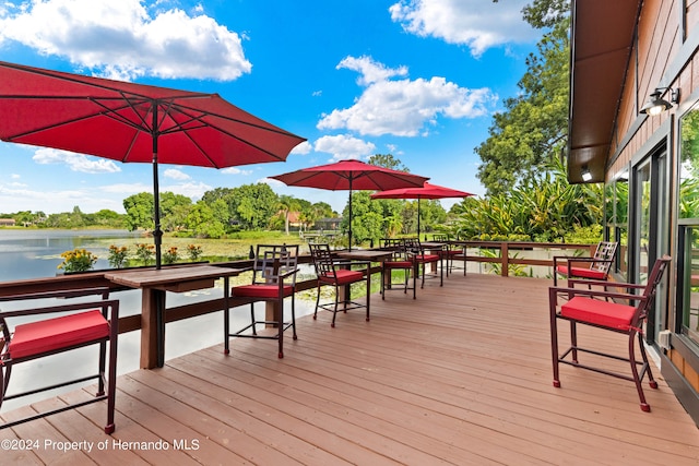 wooden deck featuring a water view