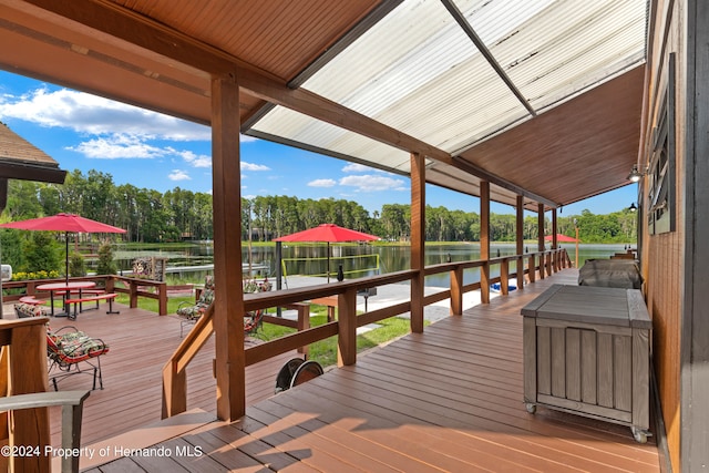 wooden deck featuring a water view