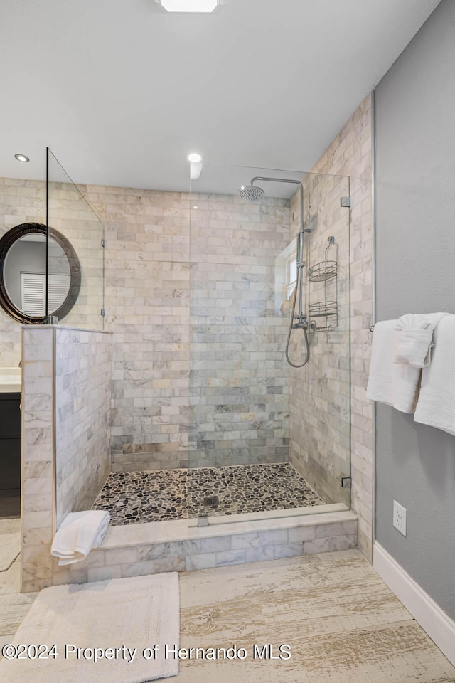 bathroom featuring a tile shower