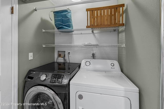 laundry room featuring separate washer and dryer