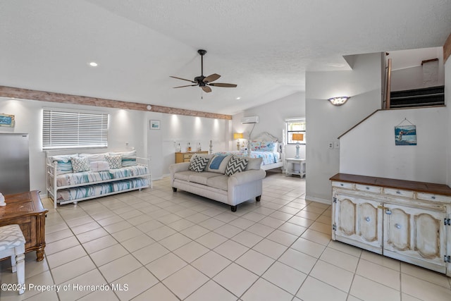 tiled living room featuring a wall unit AC, ceiling fan, and vaulted ceiling