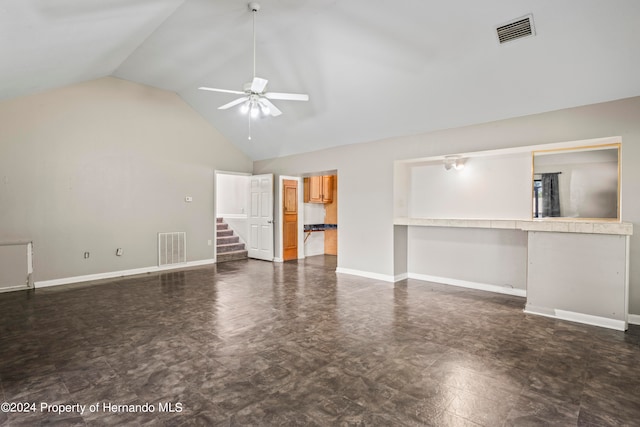 unfurnished living room featuring high vaulted ceiling and ceiling fan