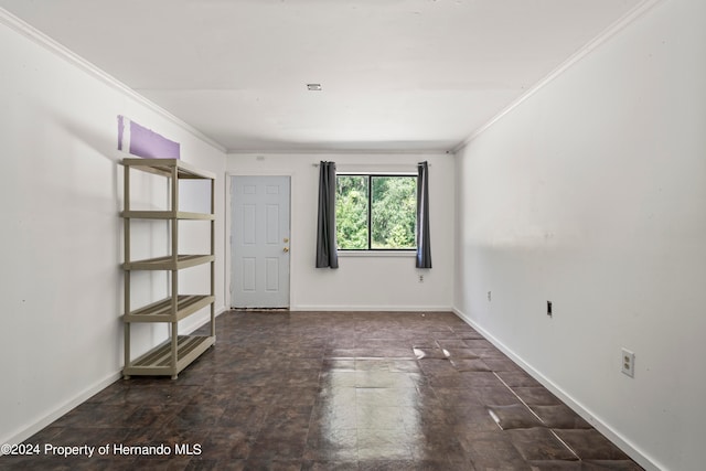 unfurnished room with ornamental molding