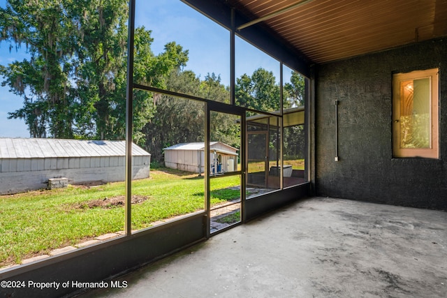 unfurnished sunroom with plenty of natural light