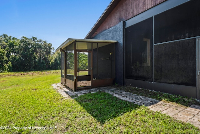 view of yard with a sunroom