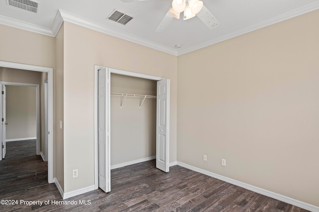 unfurnished bedroom featuring dark hardwood / wood-style flooring, a closet, ceiling fan, and ornamental molding